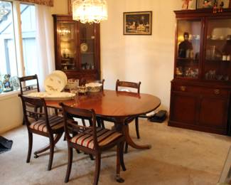Mahogany Duncan Phyfe style dining table with 6 period Regency chairs with brass inlay
