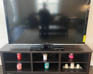 60” Vizio smart tv on black entertainment stand.