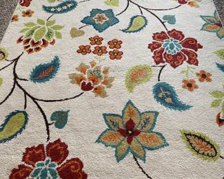 5x7 rug—there are a few synthetic rugs lying around, bigger and smaller than this