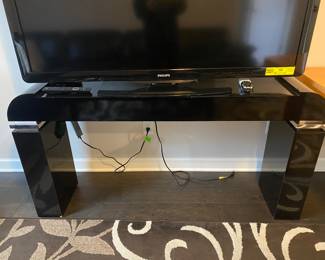 Speaking of the 80s—Art Deco Revival black high gloss console table