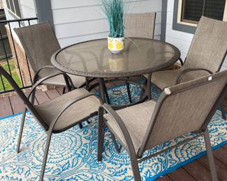 Patio set with table, 5 chairs and a chaise.