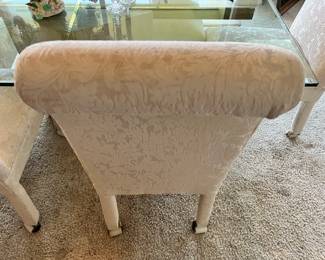 Glass Top Dining Table with Stone Base, Set of 6 White Upholstered Rolling Dining Chairs