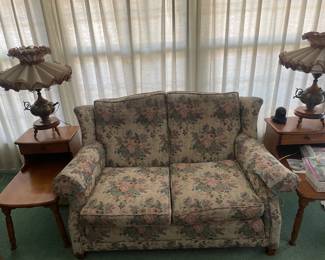 An original living set up with couch maple side tables.