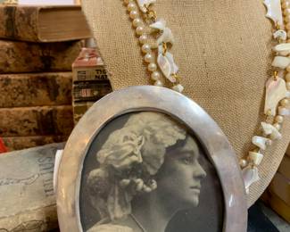 Jewelry and Sterling frame.