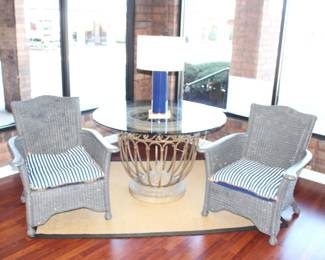 Round Glass Top Table. 48" Dia. $275.00.                             Two wicker chairs with cushions. $75.00 Each.                    28" Kate Spade Navy Lamp.  $60.00.                                             Rug under table and chairs not for sale.
