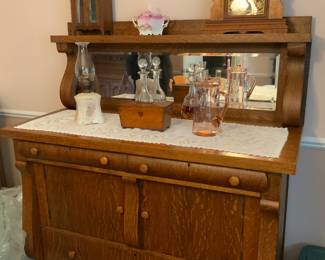 Antique side board with beveled glass