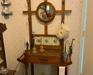 Antique hall tree.  Great size for any hall way.   Large collection of antique metal dogs of every breed