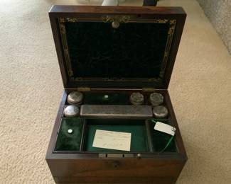 Example of antique men’s dresser set with sterling topped glass bottles.   No that is not the price. 