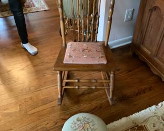 Antique rocker with embroidered foot stool and seat