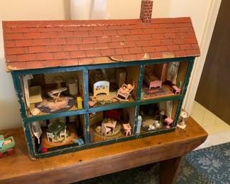 Antique doll house with vintage furniture