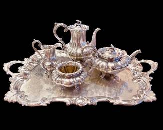 English sterling four-piece tea/coffee service.  The tray is included but is silver plated