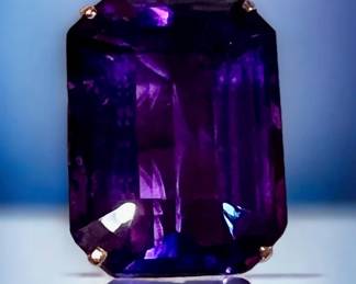 Large deep purple amethyst ring mounted in gold