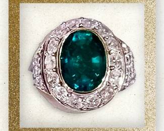 4.13 Carat emerald ring mounted in 18k yellow and white gold surround by .98 ctw of diamonds.  This ring comes with a November 2023 appraisal