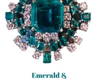 Emerald and diamond starburst brooch/pendant.  The center emerald is just under 5 carats