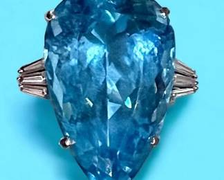 54 Aquamarine mounted in 18k white gold flanked by diamonds.  This ring comes with a current appraisal