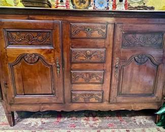 French Country carved sideboard with angled sides