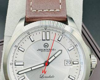 14	$100 	
Melbourne Lonsdale 2020-2143 automatic movement silver face/ brown leather band 9 1/2