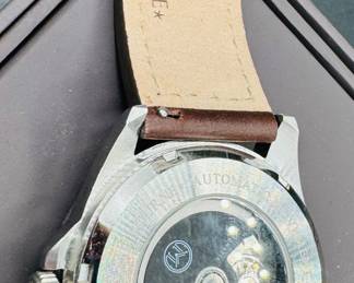 14	$100 	
Melbourne Lonsdale 2020-2143 automatic movement silver face/ brown leather band 9 1/2