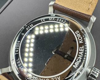 5	$24 	
Mickael Kors Black dial / brown leather 	