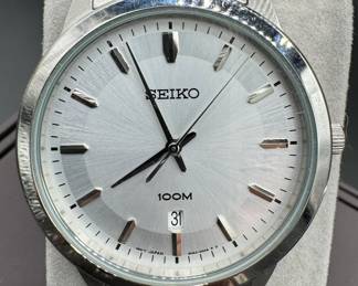 29	$50 	
Seiko silver face round, stainless steel "