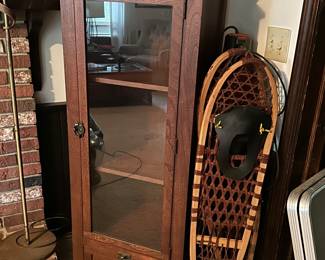 Hearth room...snowshoes and decorative cabinet