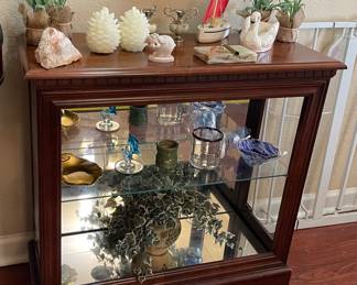 Two Shelf Curio, Assorted Decor' Silk Flowers, Acorn Candle, Ceramic Swan, Hand Carved Sailboat 