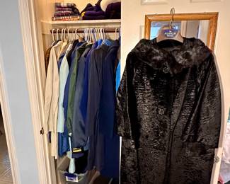 Closet full of coats.