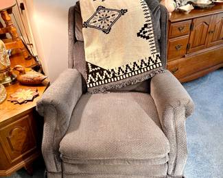 Comfortable blue-grey reclining chair.