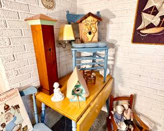 Drop leaf table & chairs in sunroom.