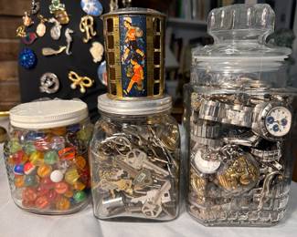 Jars of marbles, keys and watches.