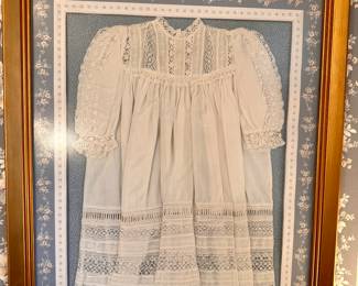 Framed christening gown.