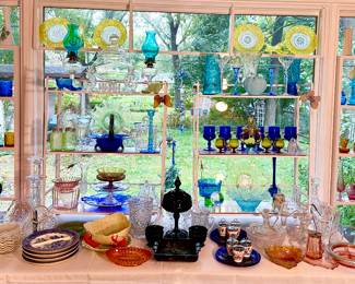 Collection of colored glassware in the living room. Murano, Cambridge,Fenton and "Glowy glass"!
