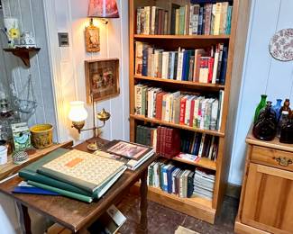 One of two bookcases filled with books.