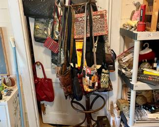 Lots of handbags, leather, cloth, designer, everyday! they are scattered around the house.