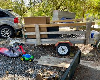 Wiggle cars, toy mower, trailer with wood sides