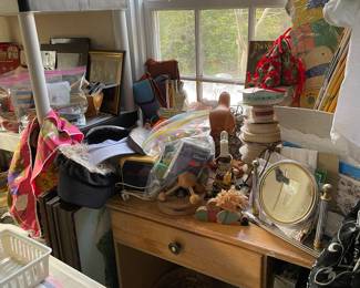 Small desk and it is loaded with all kinds of things!