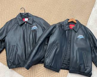 Leather, extra large, and a large. Large embroidery on the back.