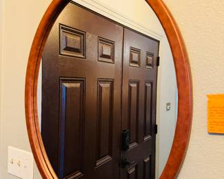 #37 - $60 brownleather style oval mirror 23x30	