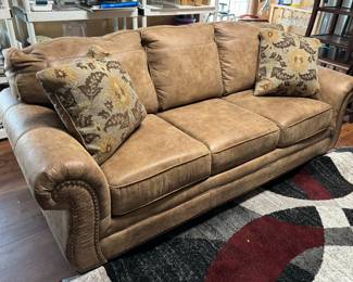 #19 - Tan faux leather sofa sleeper 88Lx37Dx36T Ashley brand - Good Condition	