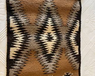 Navajo woven rug by Begay
