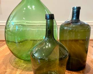 $180 - XL green, wine storage bottle - 16x26;                   $60 - olive green wine bottle or rose jar 9x15;                 $160 - straight-sided, green, glass bottle. 8.5 x 18