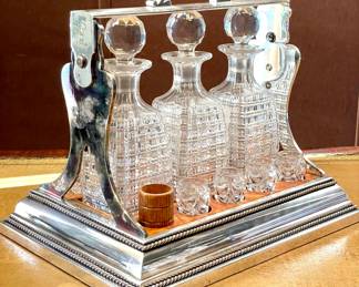 $1800 - Antique Tantalus by Betjemann’s Patent 23968 - at least 100 years old with 3 crystal decanters, 8 crystal glasses, 2 wooden cups, plus the KEY! Blue tarnish on one side-  15 x 11 x14