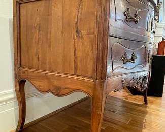 SOLD Detailed view of $3800- Louis XV walnut serpentine two drawer French Provincial chest with pieced apron, intricate hardware and diagonal wood grain of top - 47 x 26 x 35