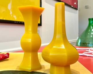 $100 - Tozai Home goldenrod-colored vase.        7.25 high; $280 -opaque yellow glass, octagonal-shaped bottle - 7.5 high.  