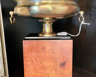 $150 - brass trophy stand on stand - 8.5 x 10 