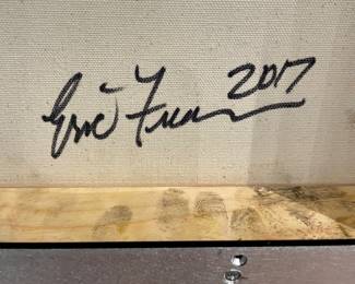 Close up of artists’ signature on reverse of “Shift (Red) (Yellow) (Blue)” by Eric Freeman; circa 2017; 20” x 20” unframed; 21” x 21” framed; sold as a suite of 3; original paintings on canvas with artist signature and date on back; framed in brushed chrome metal with black interior space between frame and canvas ($9000 set of 3)