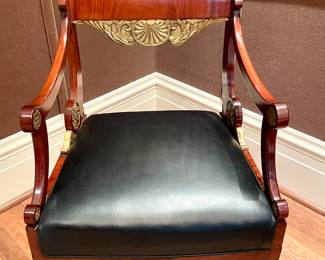 Alternate view of $2000 - Russian neoclassical chair with black, leather seat and gold-gilded accents; view of the front of the chair