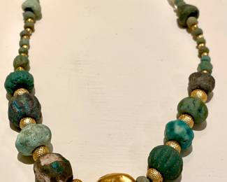 $2000 - One of a kind! Custom made necklace featuring ancient Roman glass beads, moonstone and unmarked hollow gold beads. Clasp marked 18K. 