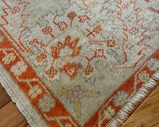 $2000 - 10’ x 13’ (approx); hand-knotted, wool rug with cream background and terracotta accents