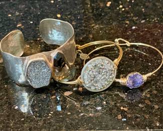 SOLD; Silpada 925 sterling silver crystal cuff.                                           SOLD; Luca & Danni rhinestone braclet with latch.                             SOLD--raw amethyst bracelet with latch.